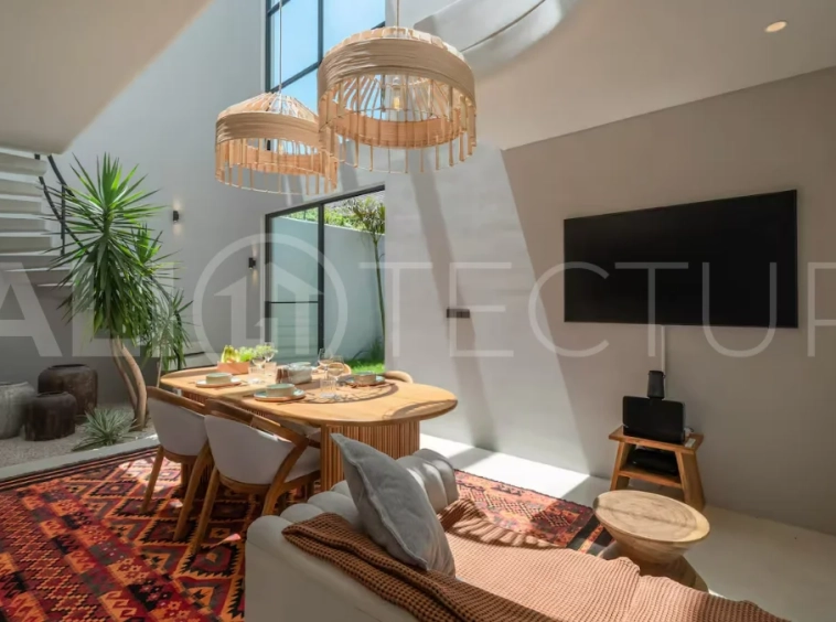 Luxury villa for sale in Canggu, featuring 590.8 m² of land, approximately 200 m² of building space, a lagoon shaped private swimming pool, tropical garden, modern interiors, private sauna, and a leasehold valid until May 2047 with an extension option.