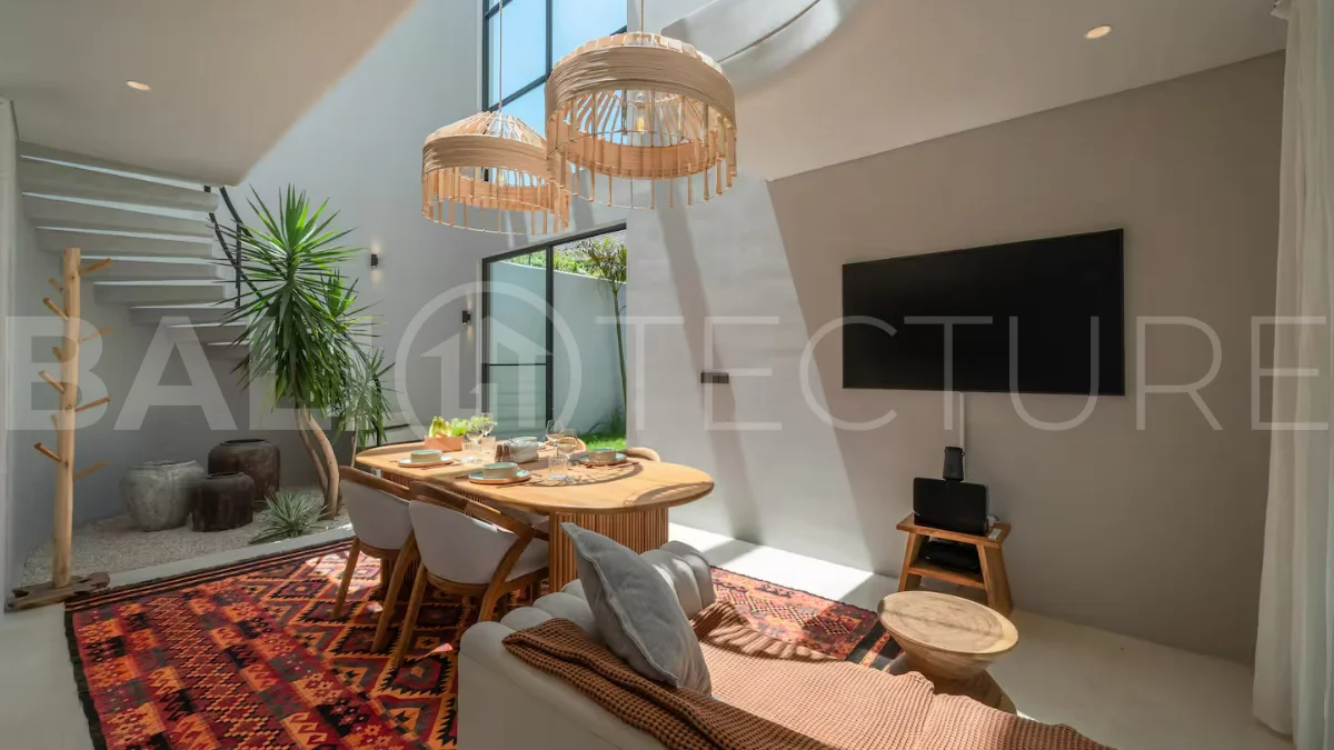Luxury villa for sale in Canggu, featuring 590.8 m² of land, approximately 200 m² of building space, a lagoon shaped private swimming pool, tropical garden, modern interiors, private sauna, and a leasehold valid until May 2047 with an extension option.