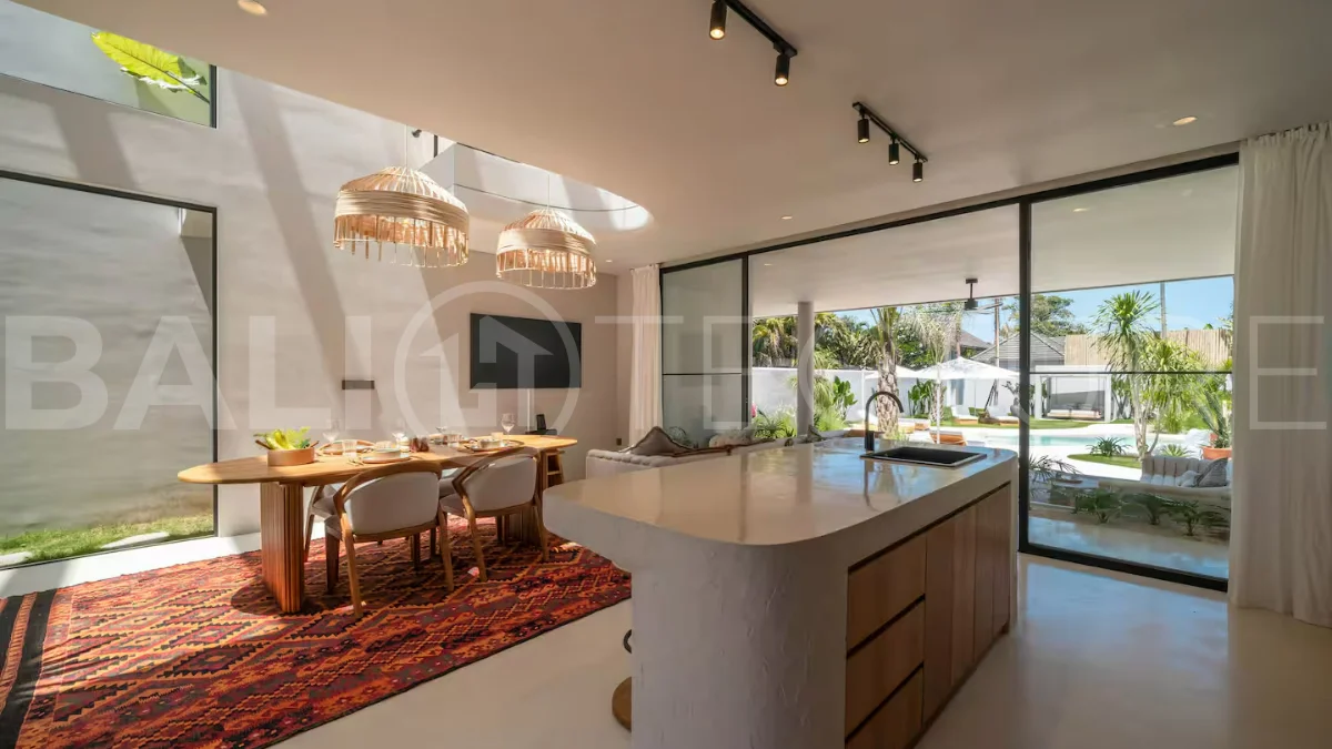 Luxury villa for sale in Canggu, featuring 590.8 m² of land, approximately 200 m² of building space, a lagoon shaped private swimming pool, tropical garden, modern interiors, private sauna, and a leasehold valid until May 2047 with an extension option.