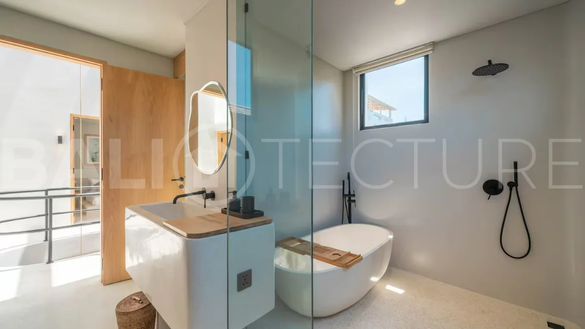 Luxury villa for sale in Canggu, featuring 590.8 m² of land, approximately 200 m² of building space, a lagoon shaped private swimming pool, tropical garden, modern interiors, private sauna, and a leasehold valid until May 2047 with an extension option.