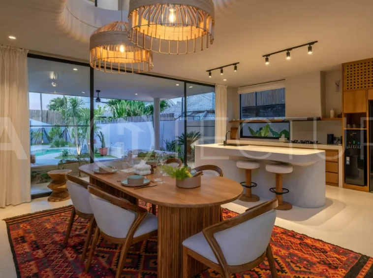Luxury villa for sale in Canggu, featuring 590.8 m² of land, approximately 200 m² of building space, a lagoon shaped private swimming pool, tropical garden, modern interiors, private sauna, and a leasehold valid until May 2047 with an extension option.