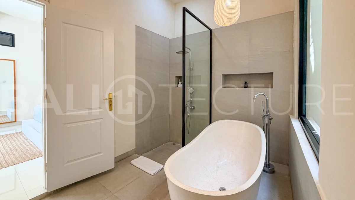 1-bedroom tropical villa for sale in Kayu Tulang, Canggu, featuring a private swimming pool, spacious bedroom, modern interiors, and a landscaped outdoor terrace.