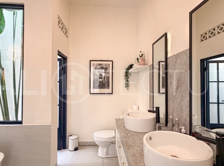 1-bedroom tropical villa for sale in Kayu Tulang, Canggu, featuring a private swimming pool, spacious bedroom, modern interiors, and a landscaped outdoor terrace.