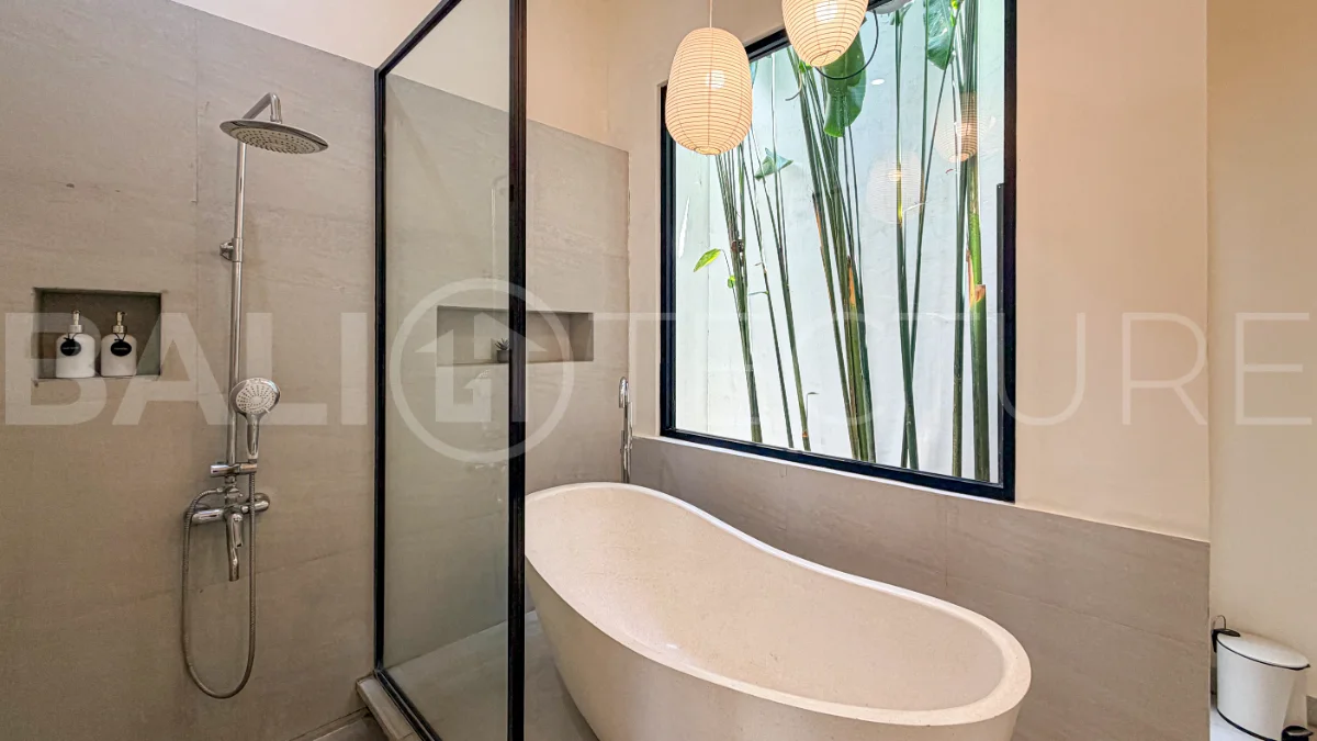 1-bedroom tropical villa for sale in Kayu Tulang, Canggu, featuring a private swimming pool, spacious bedroom, modern interiors, and a landscaped outdoor terrace.