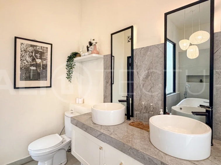 1-bedroom tropical villa for sale in Kayu Tulang, Canggu, featuring a private swimming pool, spacious bedroom, modern interiors, and a landscaped outdoor terrace.