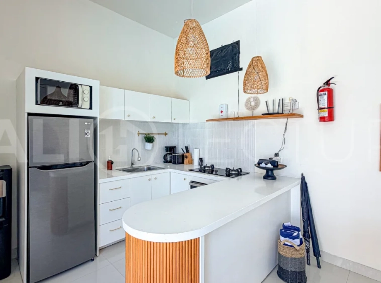 1-bedroom tropical villa for sale in Kayu Tulang, Canggu, featuring a private swimming pool, spacious bedroom, modern interiors, and a landscaped outdoor terrace.