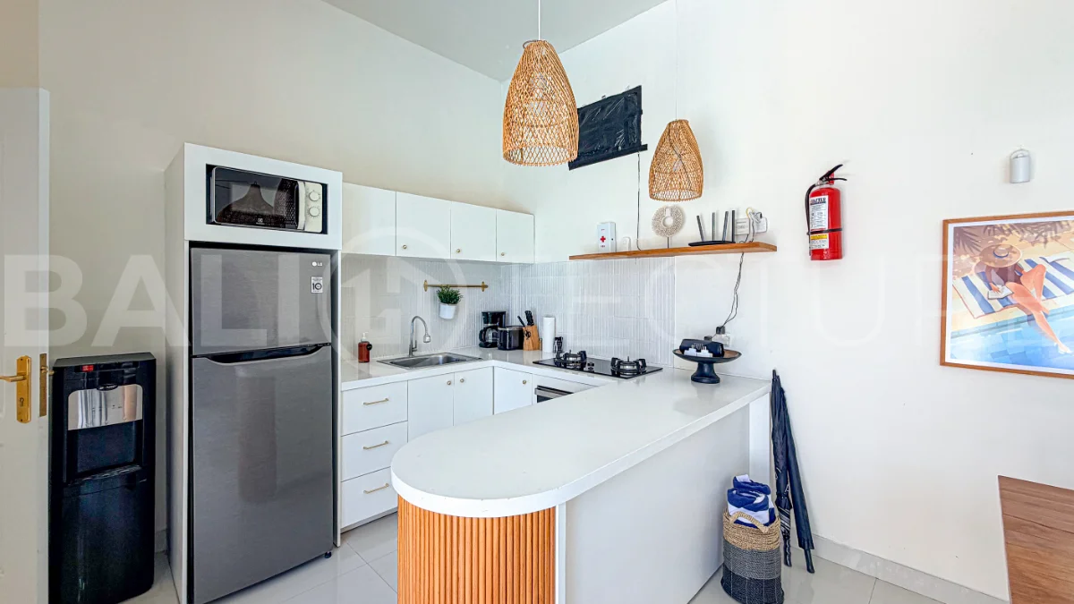 1-bedroom tropical villa for sale in Kayu Tulang, Canggu, featuring a private swimming pool, spacious bedroom, modern interiors, and a landscaped outdoor terrace.