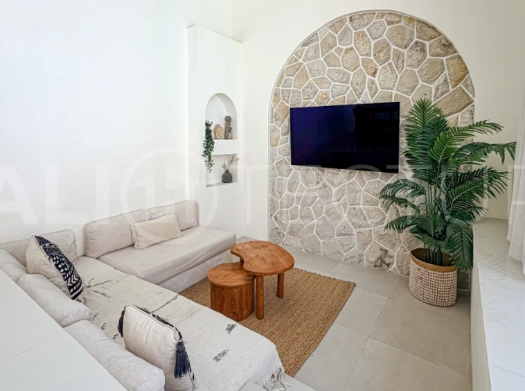 1-bedroom tropical villa for sale in Kayu Tulang, Canggu, featuring a private swimming pool, spacious bedroom, modern interiors, and a landscaped outdoor terrace.