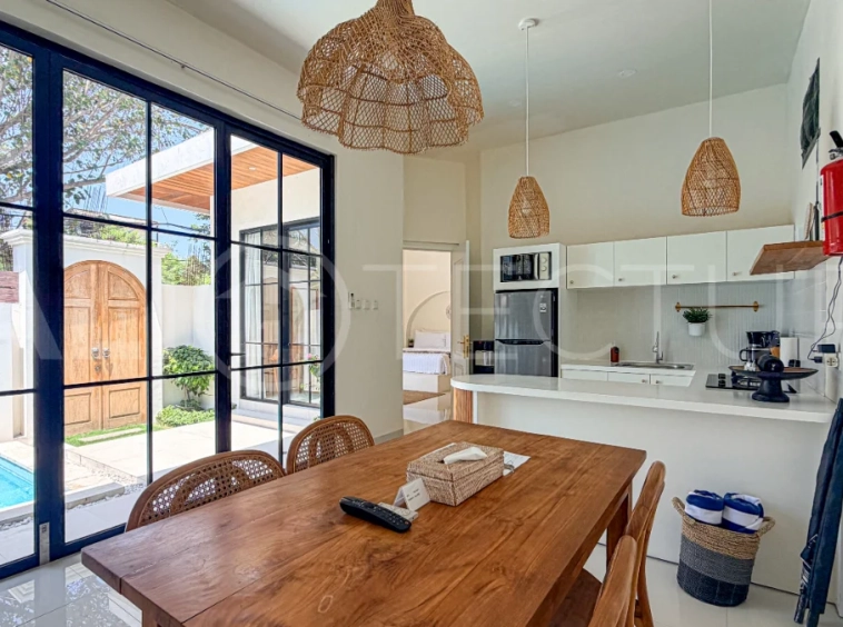 1-bedroom tropical villa for sale in Kayu Tulang, Canggu, featuring a private swimming pool, spacious bedroom, modern interiors, and a landscaped outdoor terrace.