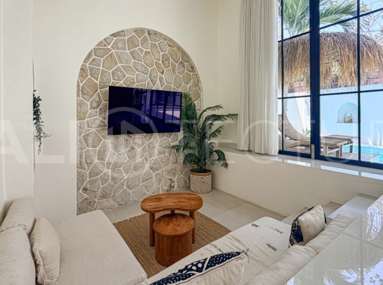 1-bedroom tropical villa for sale in Kayu Tulang, Canggu, featuring a private swimming pool, spacious bedroom, modern interiors, and a landscaped outdoor terrace.