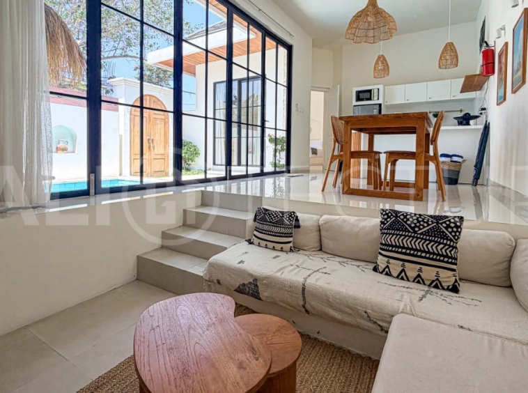 1-bedroom tropical villa for sale in Kayu Tulang, Canggu, featuring a private swimming pool, spacious bedroom, modern interiors, and a landscaped outdoor terrace.