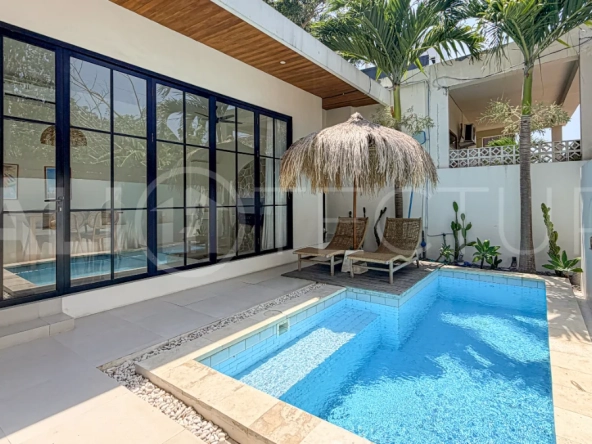 1-bedroom tropical villa for sale in Kayu Tulang, Canggu, featuring a private swimming pool, spacious bedroom, modern interiors, and a landscaped outdoor terrace.