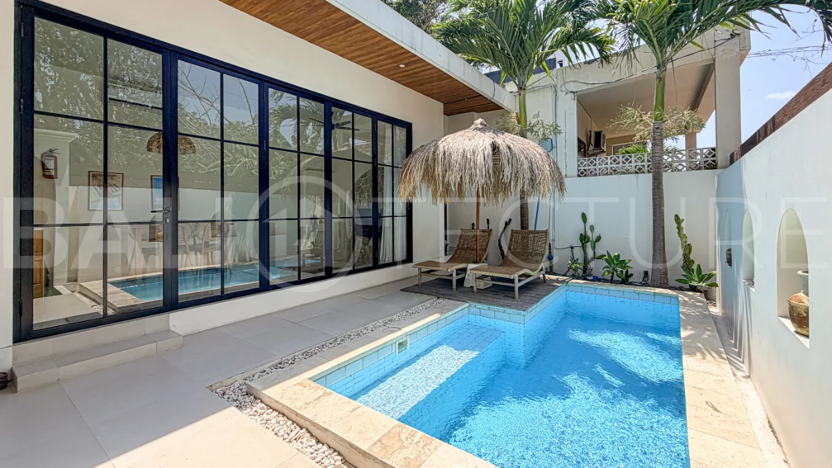 1-bedroom tropical villa for sale in Kayu Tulang, Canggu, featuring a private swimming pool, spacious bedroom, modern interiors, and a landscaped outdoor terrace.