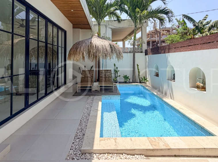 1-bedroom tropical villa for sale in Kayu Tulang, Canggu, featuring a private swimming pool, spacious bedroom, modern interiors, and a landscaped outdoor terrace.