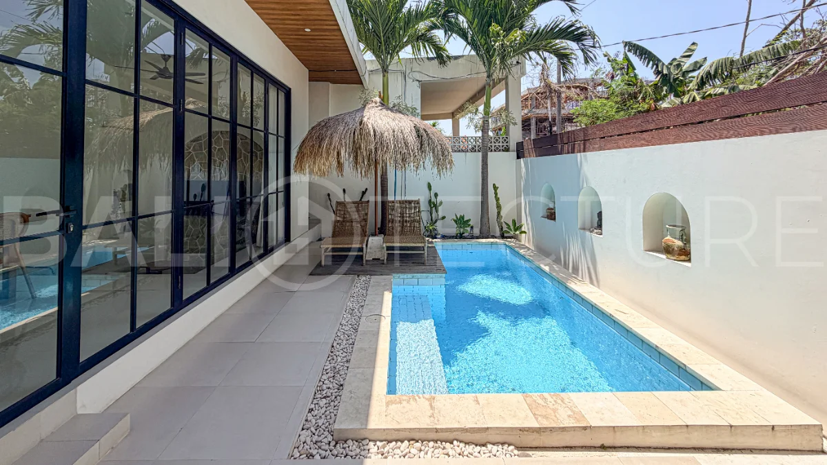 1-bedroom tropical villa for sale in Kayu Tulang, Canggu, featuring a private swimming pool, spacious bedroom, modern interiors, and a landscaped outdoor terrace.