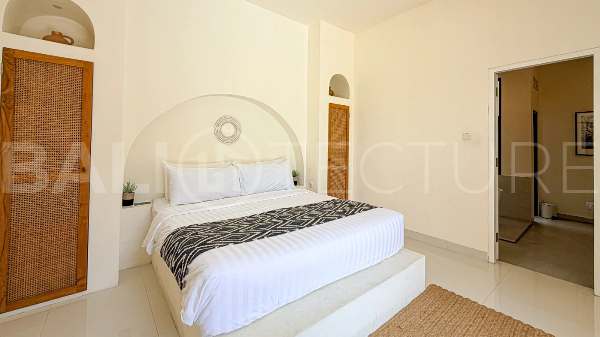 1-bedroom tropical villa for sale in Kayu Tulang, Canggu, featuring a private swimming pool, spacious bedroom, modern interiors, and a landscaped outdoor terrace.