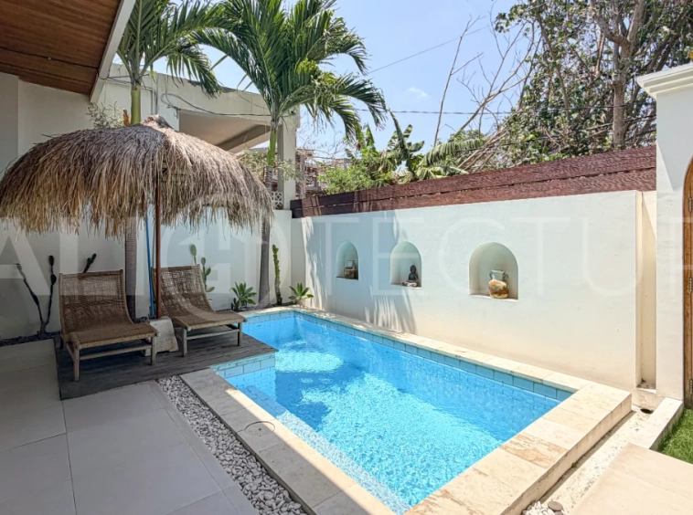 1-bedroom tropical villa for sale in Kayu Tulang, Canggu, featuring a private swimming pool, spacious bedroom, modern interiors, and a landscaped outdoor terrace.