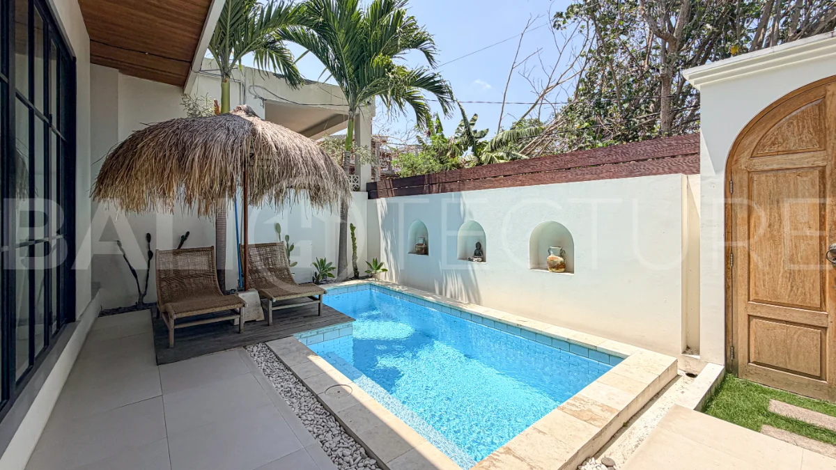 1-bedroom tropical villa for sale in Kayu Tulang, Canggu, featuring a private swimming pool, spacious bedroom, modern interiors, and a landscaped outdoor terrace.