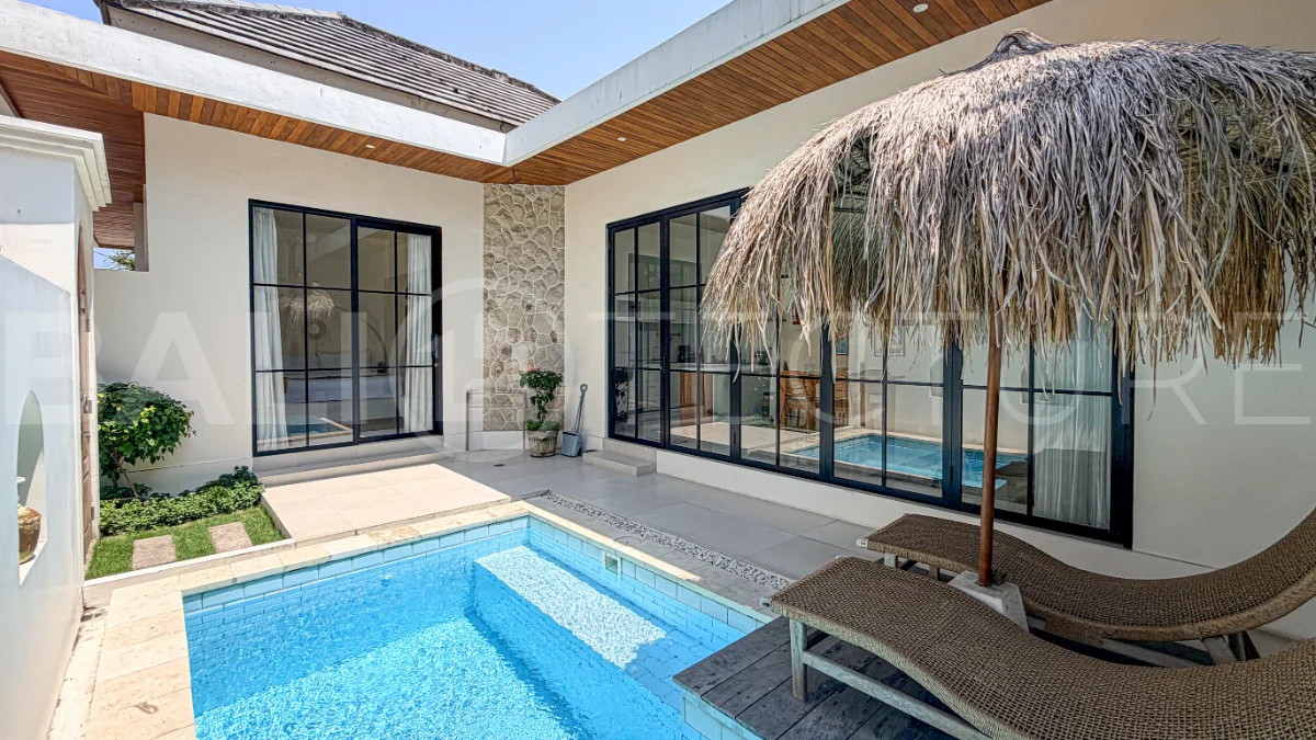 1-bedroom tropical villa for sale in Kayu Tulang, Canggu, featuring a private swimming pool, spacious bedroom, modern interiors, and a landscaped outdoor terrace.