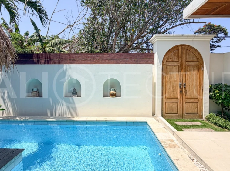 1-bedroom tropical villa for sale in Kayu Tulang, Canggu, featuring a private swimming pool, spacious bedroom, modern interiors, and a landscaped outdoor terrace.